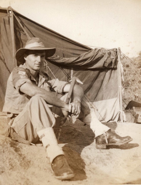 A person in a cowboy hat sitting in a hammock

Description automatically generated with medium confidence